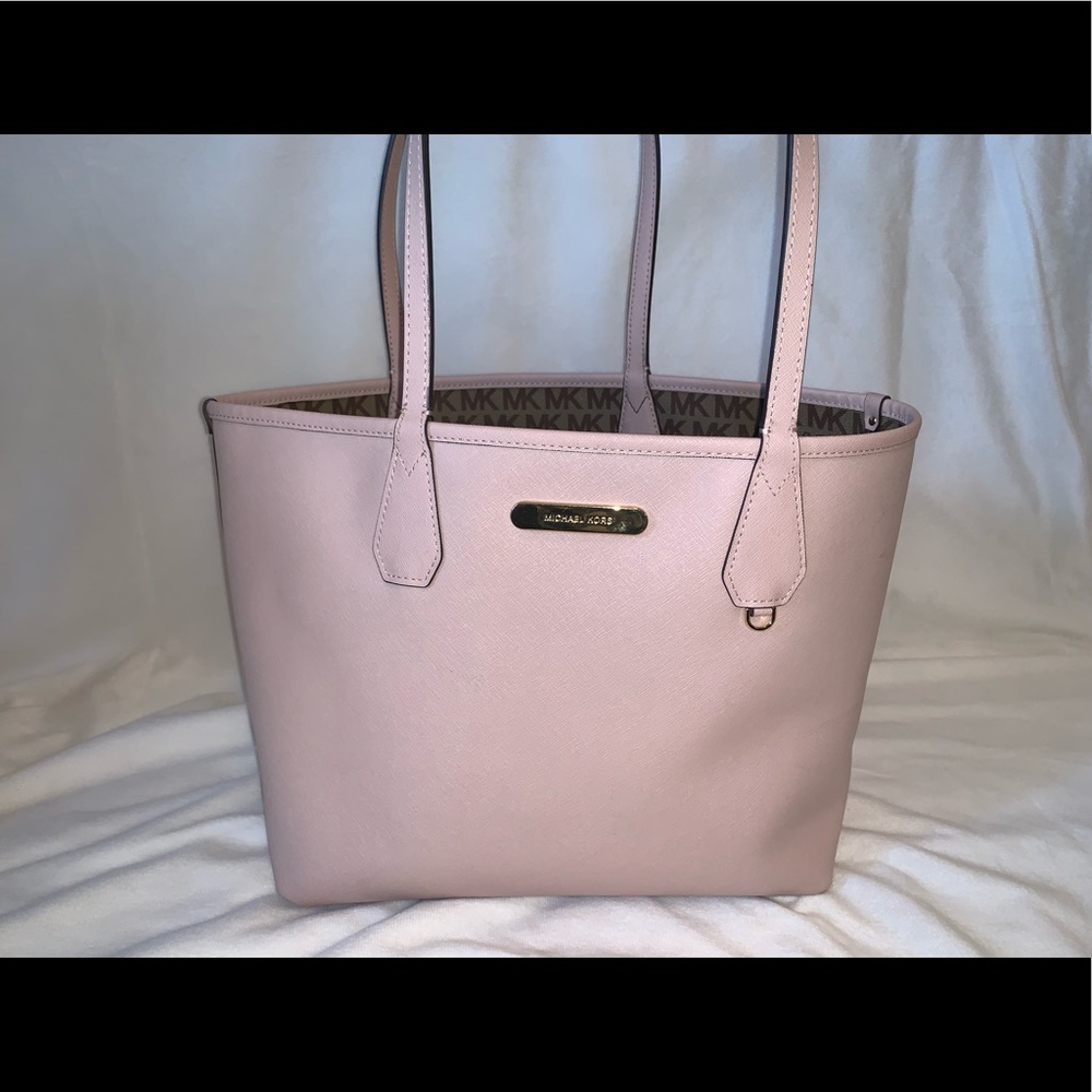 Reversible pink/brown MK purse.
